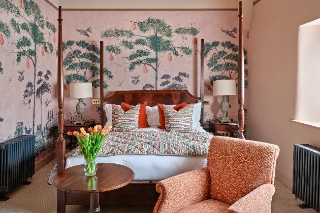 pink bedrom with mural on walls 